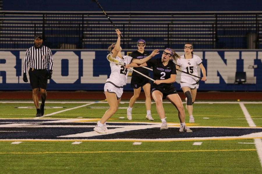 Mary Doherty takes a draw control for the Blue Streaks as she utilizes her aggression and tenacity.