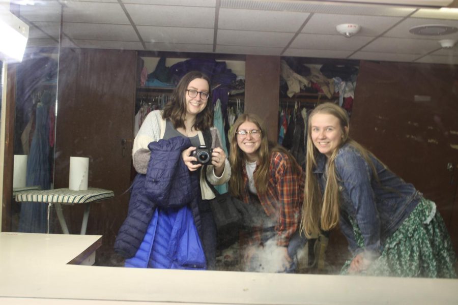 Editors, Claire Schuppel, Grace Sherban, and Corinne McDevitt snap a photo in the mirror. (photo by Claire Schuppel.)