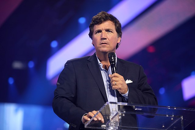 Tucker+Carlson+speaking+with+attendees+at+the+2022+AmericaFest+at+the+Phoenix+Convention+Center+in+Phoenix%2C+Arizona.