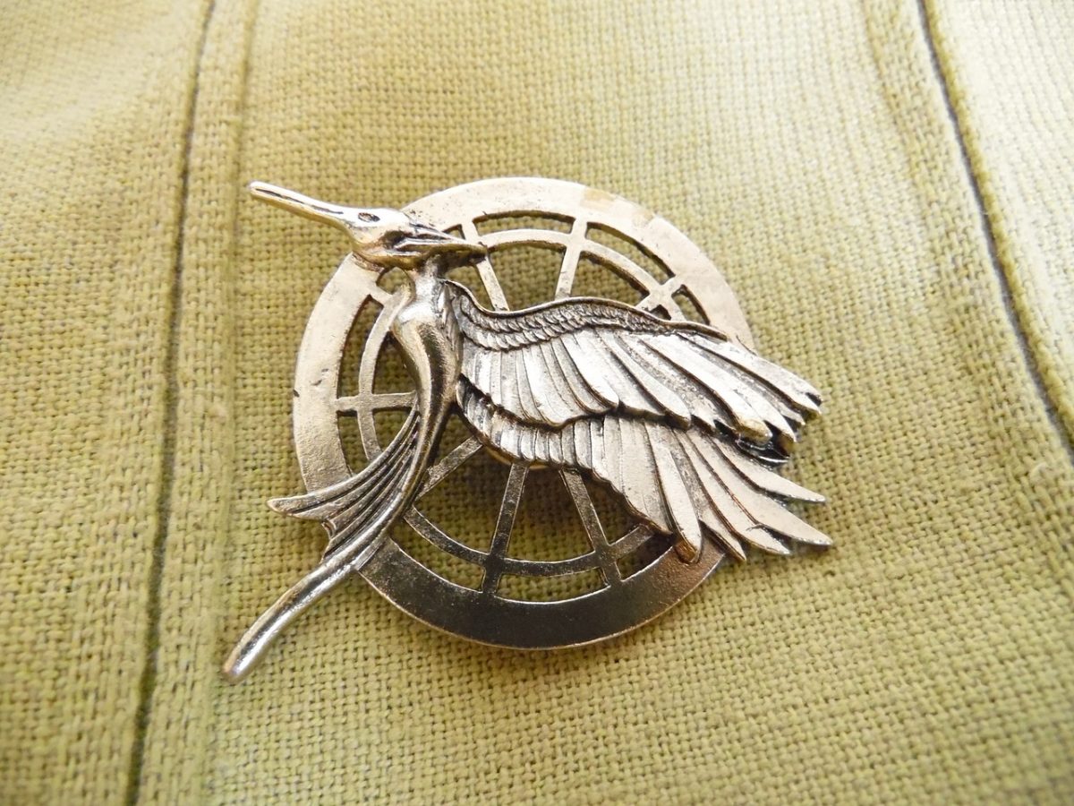 The Mockingjay pin from the series The Hunger Games.