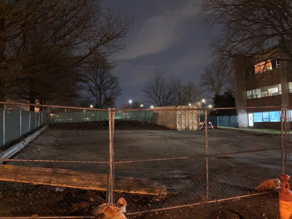 The gravel parking lot between Grasselli Library and Admin Drive was blocked off to allow for construction. This will be reopened once the construction at the library is complete.