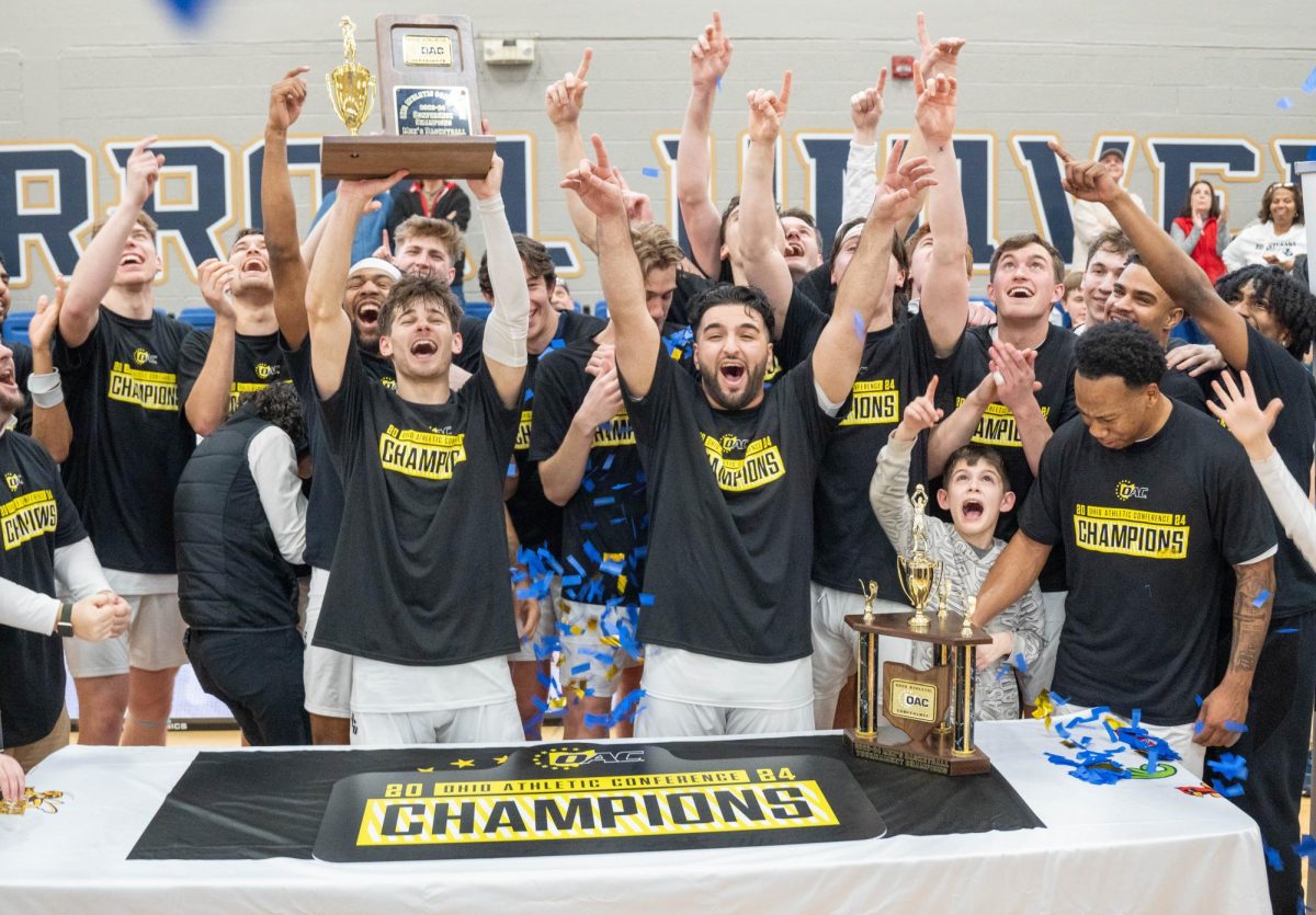 John Carroll mens basketball celebrates after a narrow victory against Mount Union in the OAC Championship.