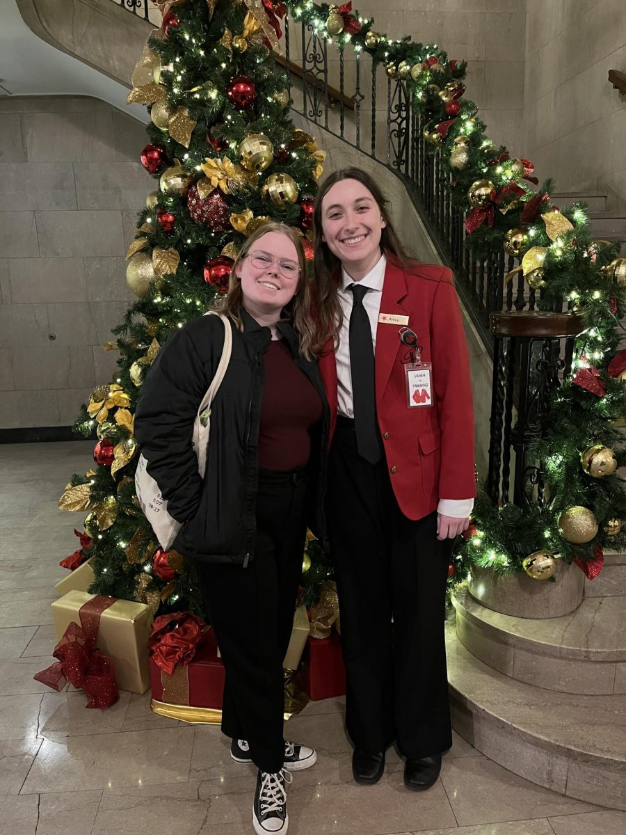 Anna Maxwell and her friend Mia at Playhouse Square following a shift as a RedCoat volunteer. 