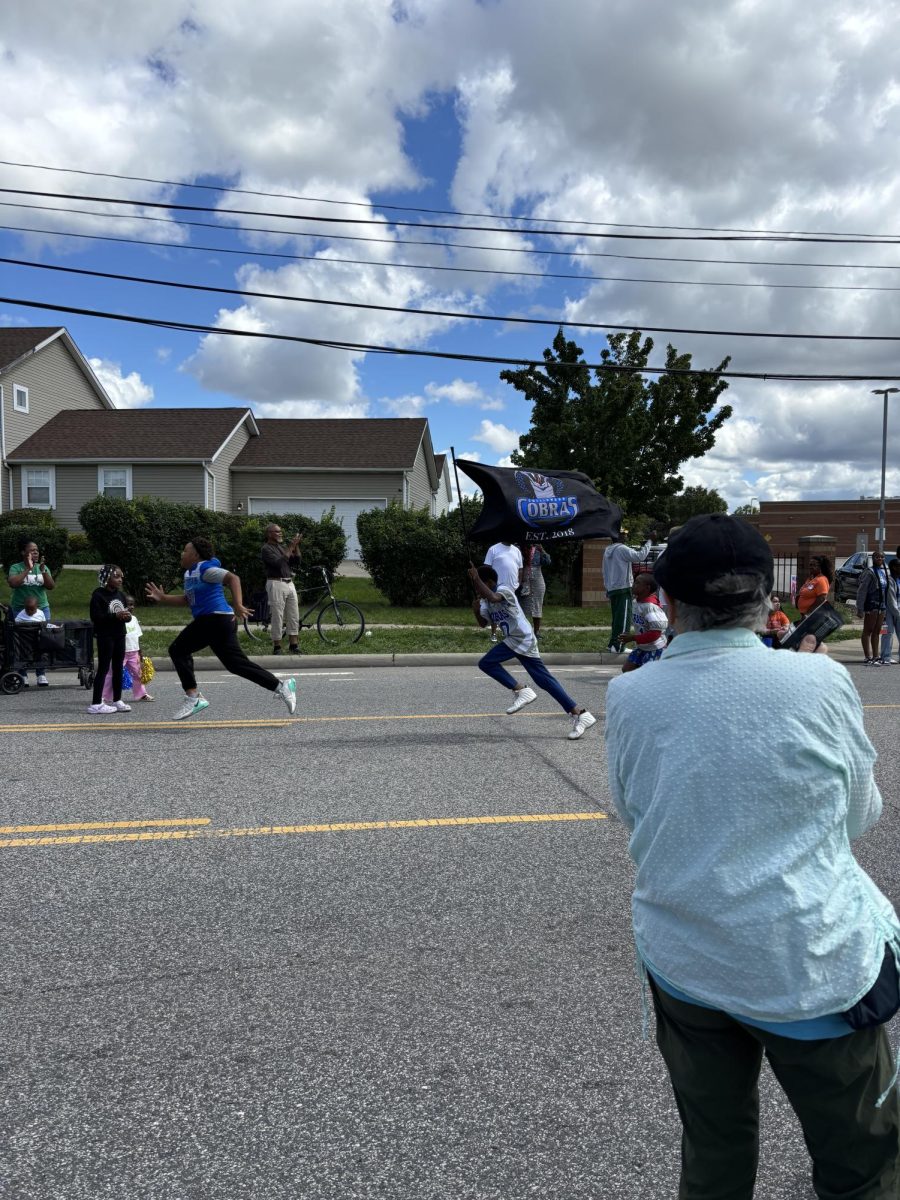 A young 'Collinwood Cobra' leading marchers 