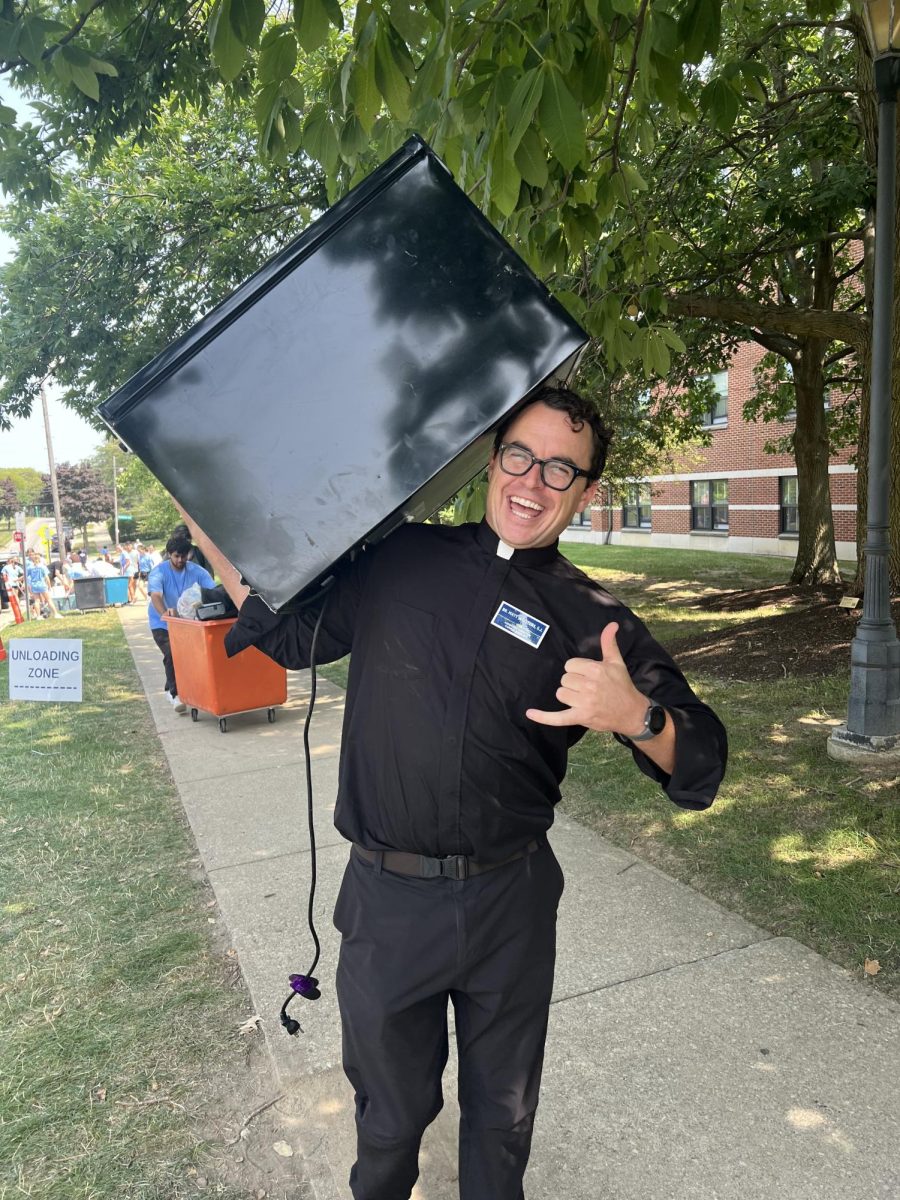 Br. Wooters assisted first year students with moving in to their dorms this year