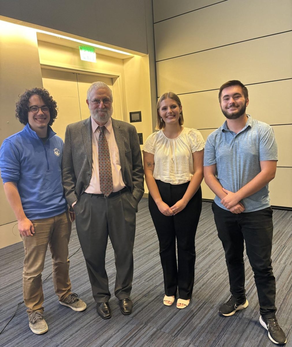 JCU Students (left to right) Ian McMichael '26, Emily Blasko '25, and Michael Walsh '25 with Dr. James Grossman