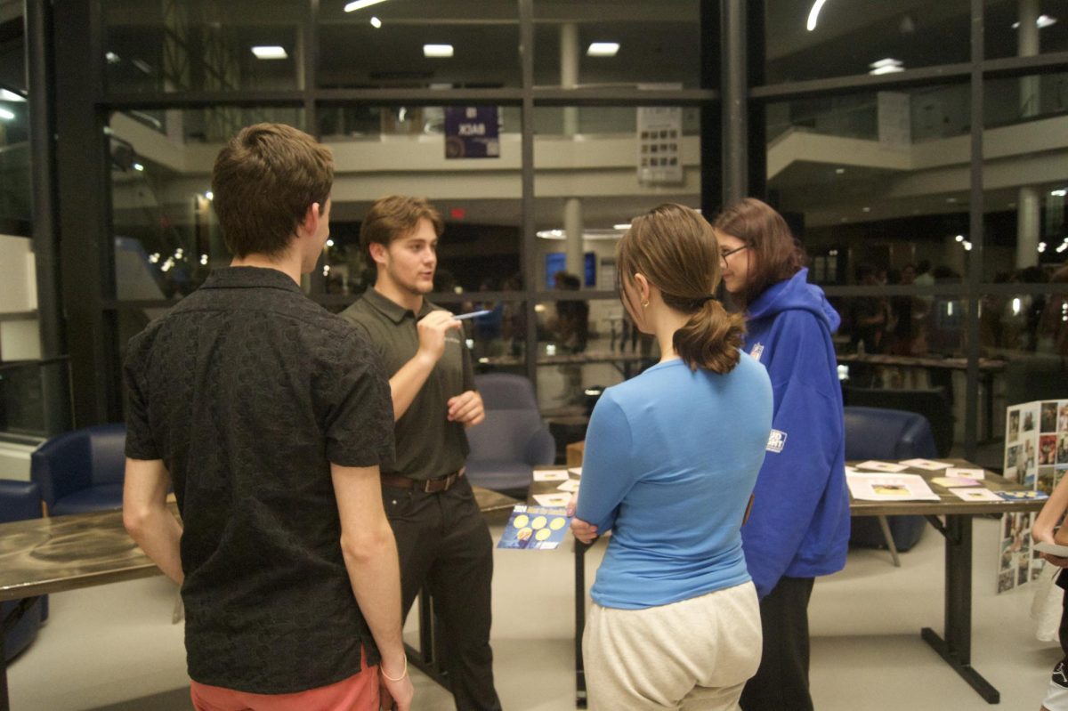 Director of Student Organizations candidate Chad Harpster '26 speaking with fellow students