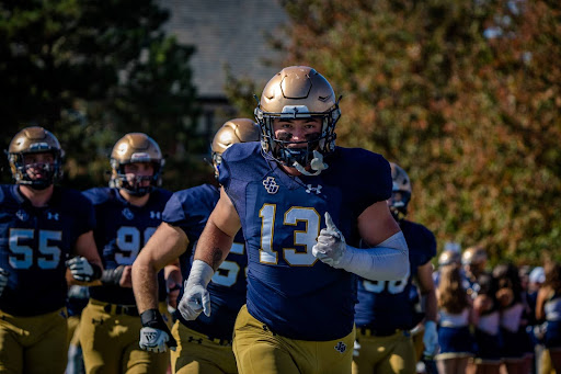 
Linebacker Kenny Grobolsek ’28 (#13) leads the Blue Streaks onto the field
