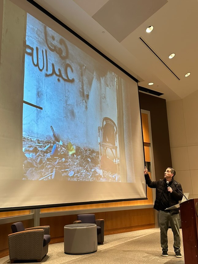 Badawi showing numerous photos from his time in Gaza in years past