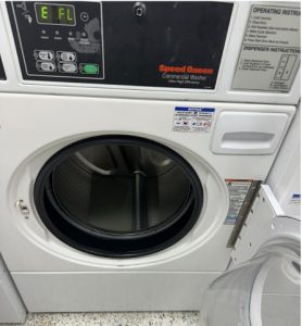 A dryer machine in Pacelli Hall that is out of order. 
