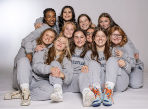 Members of the JCU Women's Wrestling team pose for a picture.