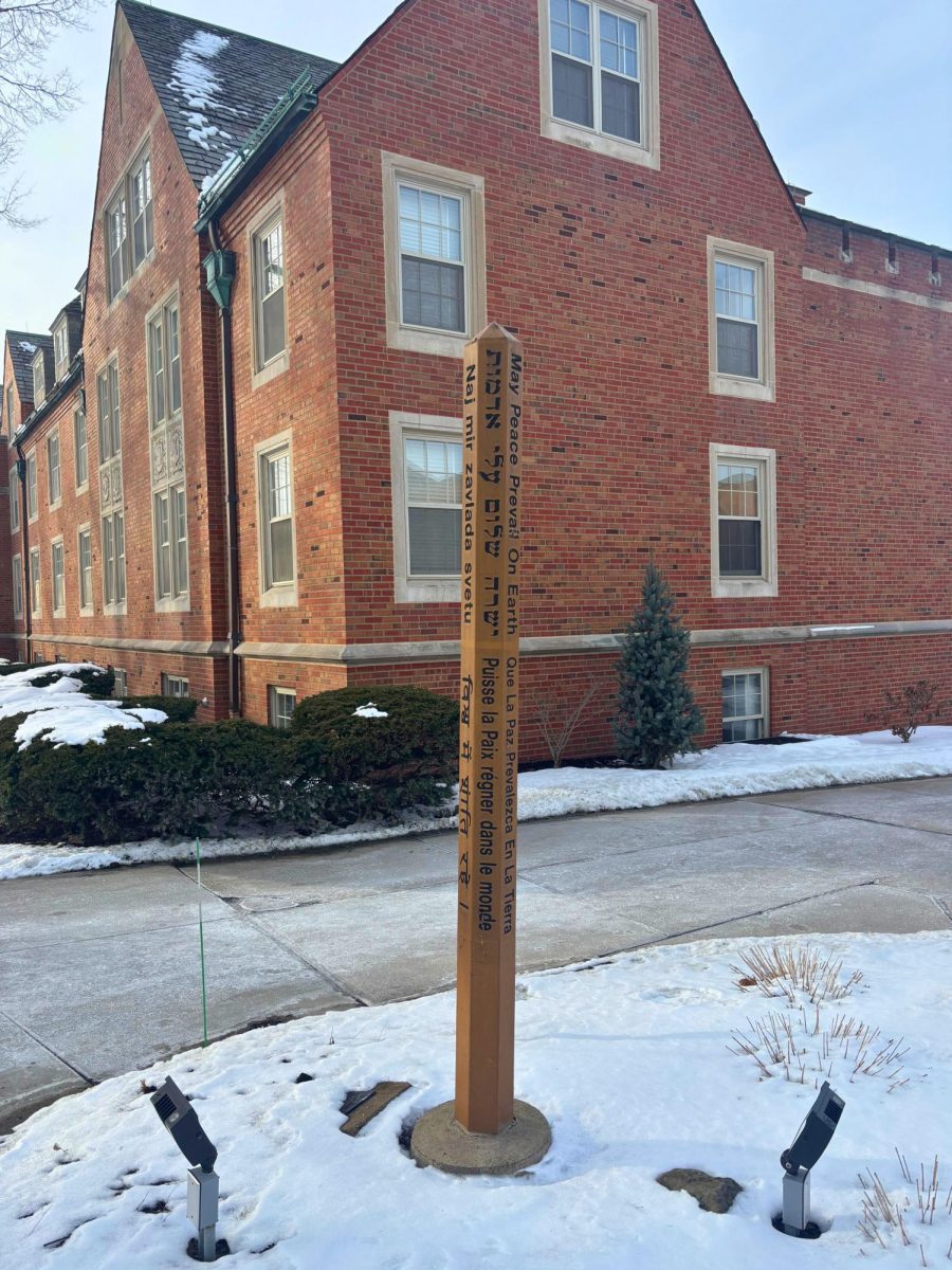 Peace Pole on Campus, which translates in Hebrew to "May Peace Prevail on Earth"