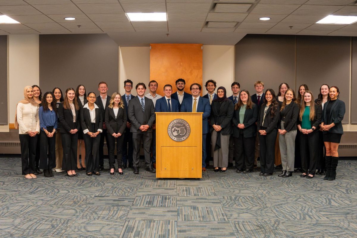 Student Government members, both new and old, gather for the inauguration of new senators