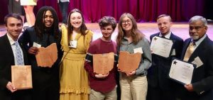 Left to right: 
2023-24 Multimedia Audio Editor Evan Richwalsky '24, 2024-25 Sports Editor Michael Patterson '25, Managing Editor Anna Maxwell '27, Editor-in-Chief Brian Keim '26, 2024-25 Editor-in-Chief Grace Sherban '25, Campus Editor Jacob Meyers '28 and faculty adviser Cliff Anthony. 