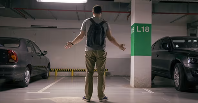 A person looking for their car after it has gone missing.