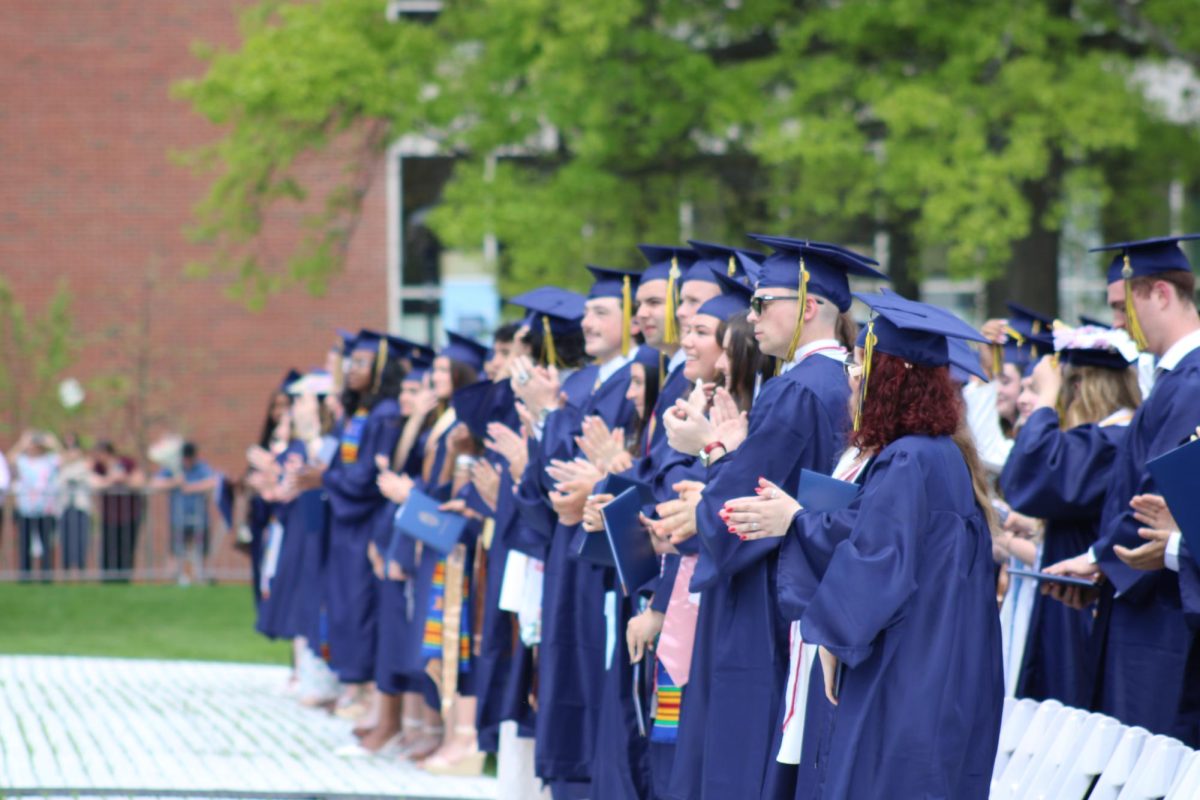 Graduates celebrate after moving their tassles to symbolize officially graduating.