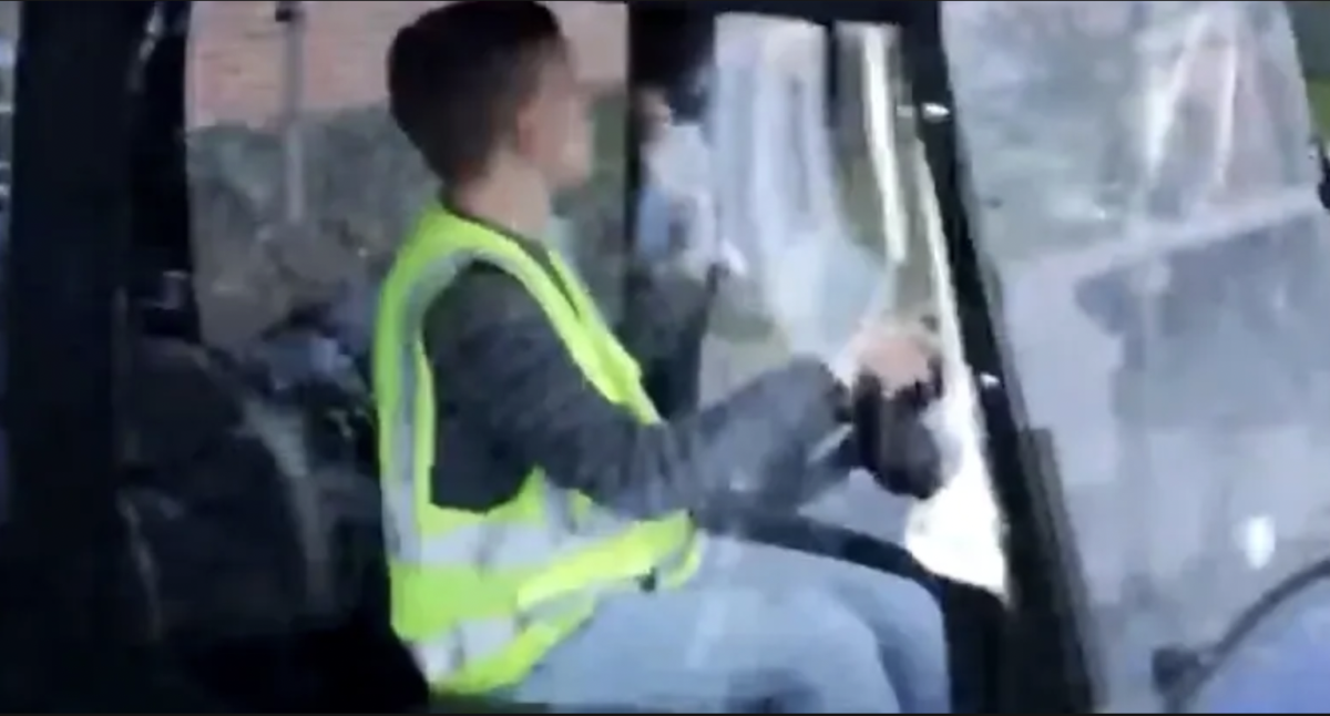 Jacob Meyers drives a golf cart around John Carroll University's campus. 