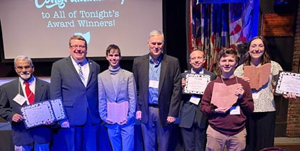 (from left) Cliff Anthony, Jasen Sokol, Brendan Elbin '28, Brent Brossmann, Jacob Meyers '28, Brian Keim '26 and Anna Maxwell '27 show off their awards.  